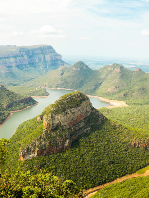 small hill formations with a large lake in the middle