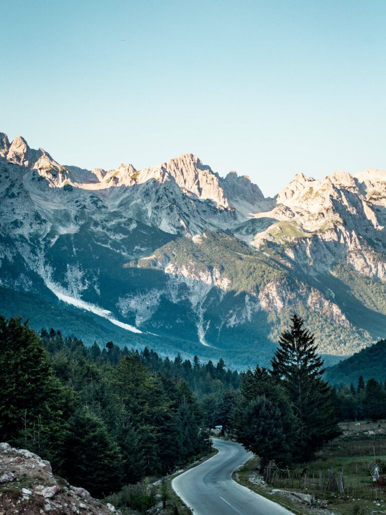 view of road with snowy mountain in the backdrop