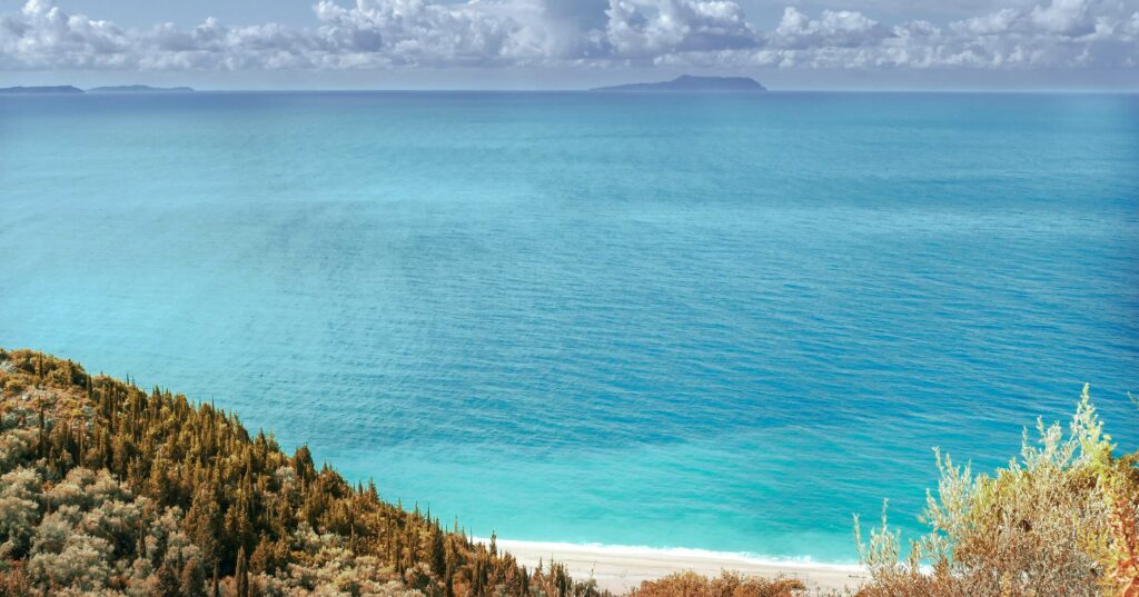 FINAL view of vast body of water from a cliff